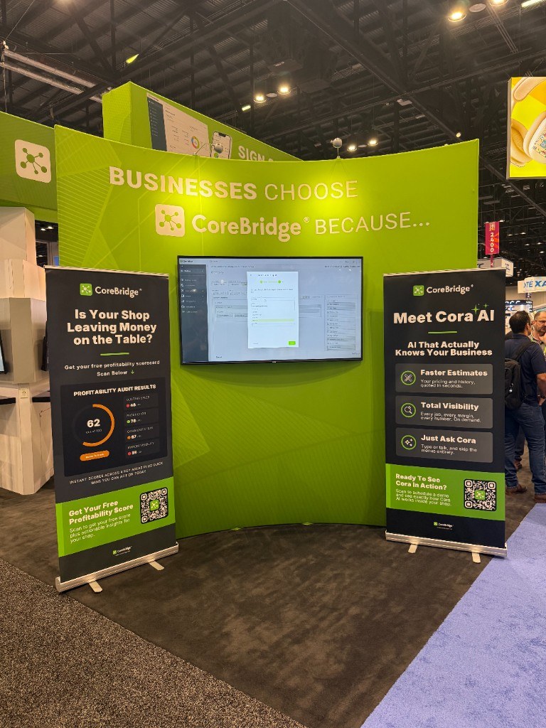 CoreBridge booth displays and software on screen
